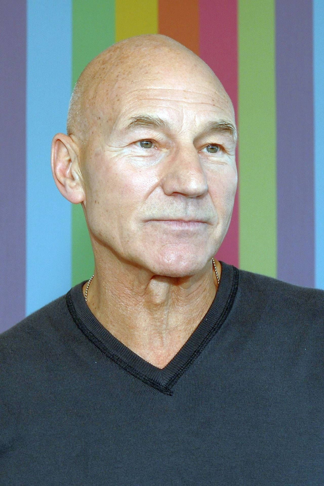 Legendary Actor Patrick Stewart Rocking A V-neck Top Background