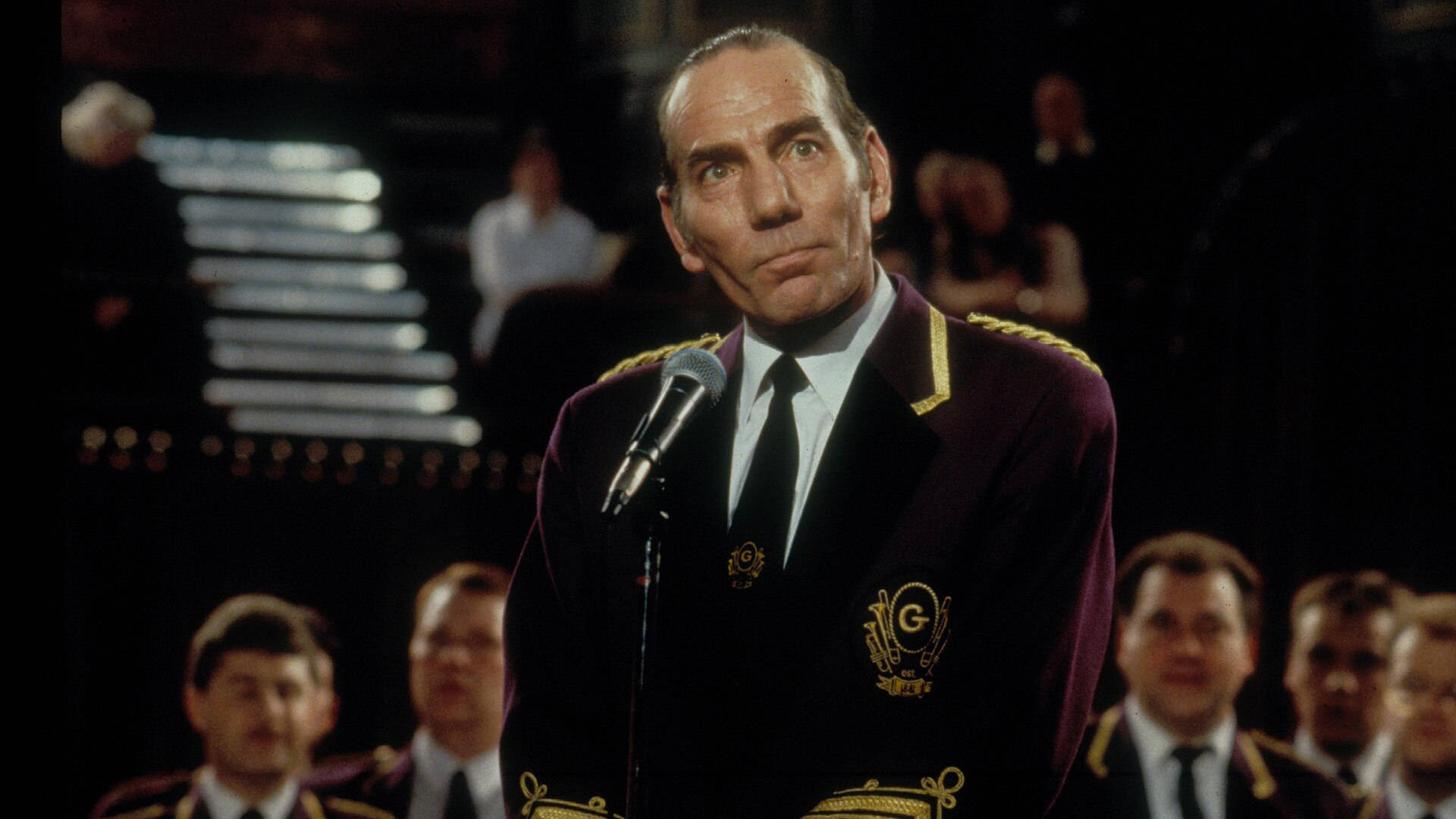 Legendary Actor Pete Postlethwaite In A Still From The Movie Brassed Off Background