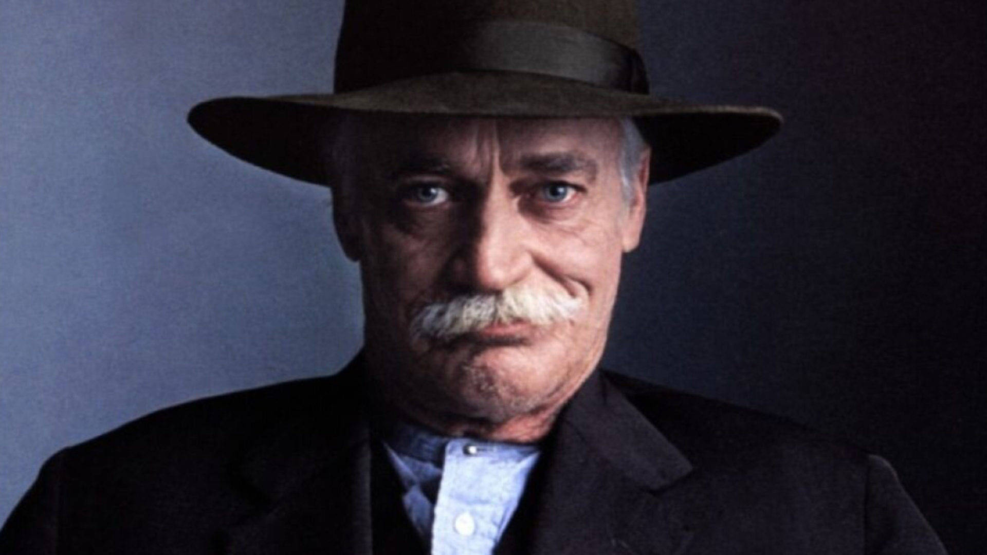 Legendary Actor Richard Farnsworth In Cowboy Hat Background