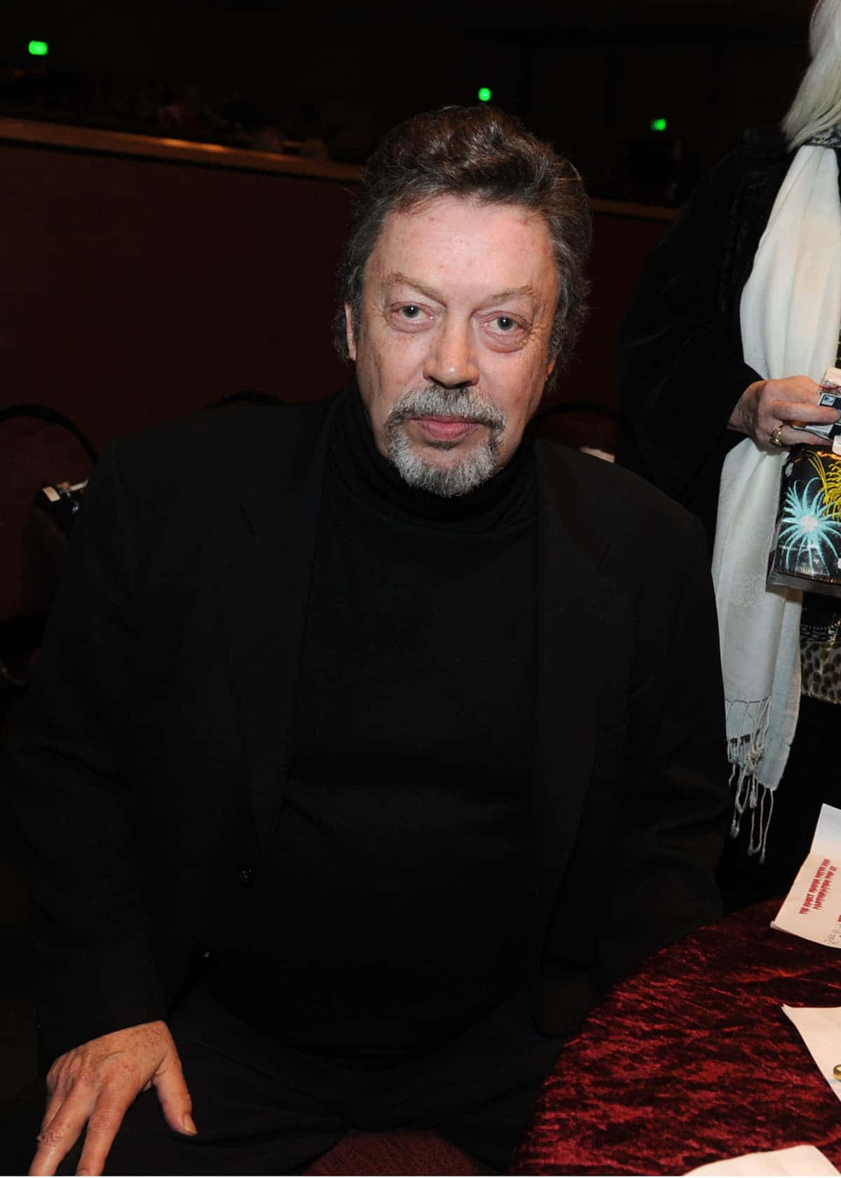 Legendary Actor Tim Curry In A Dashing Suit Background