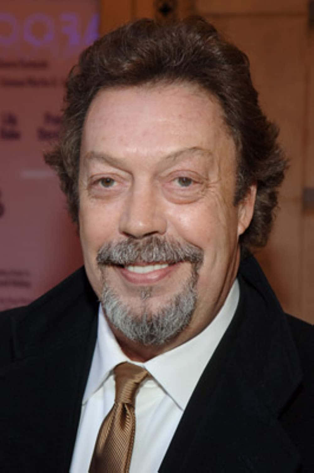 Legendary Actor Tim Curry In A Stunning Portrait Background