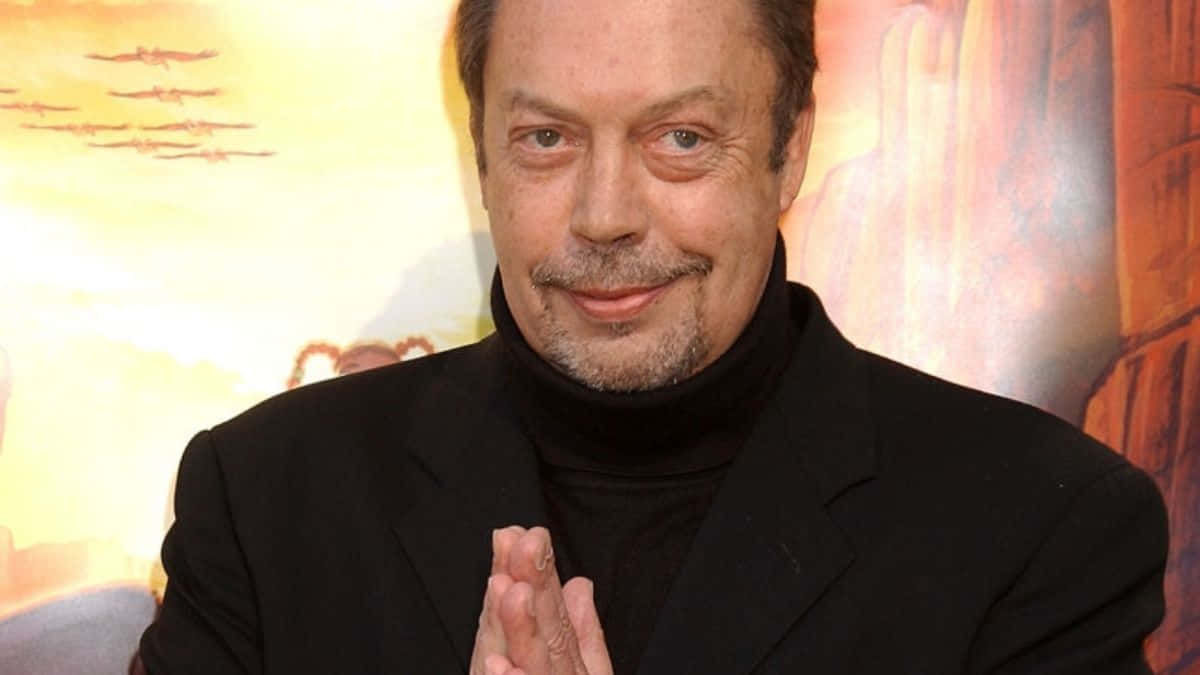 Legendary Actor Tim Curry In Iconic Role Background