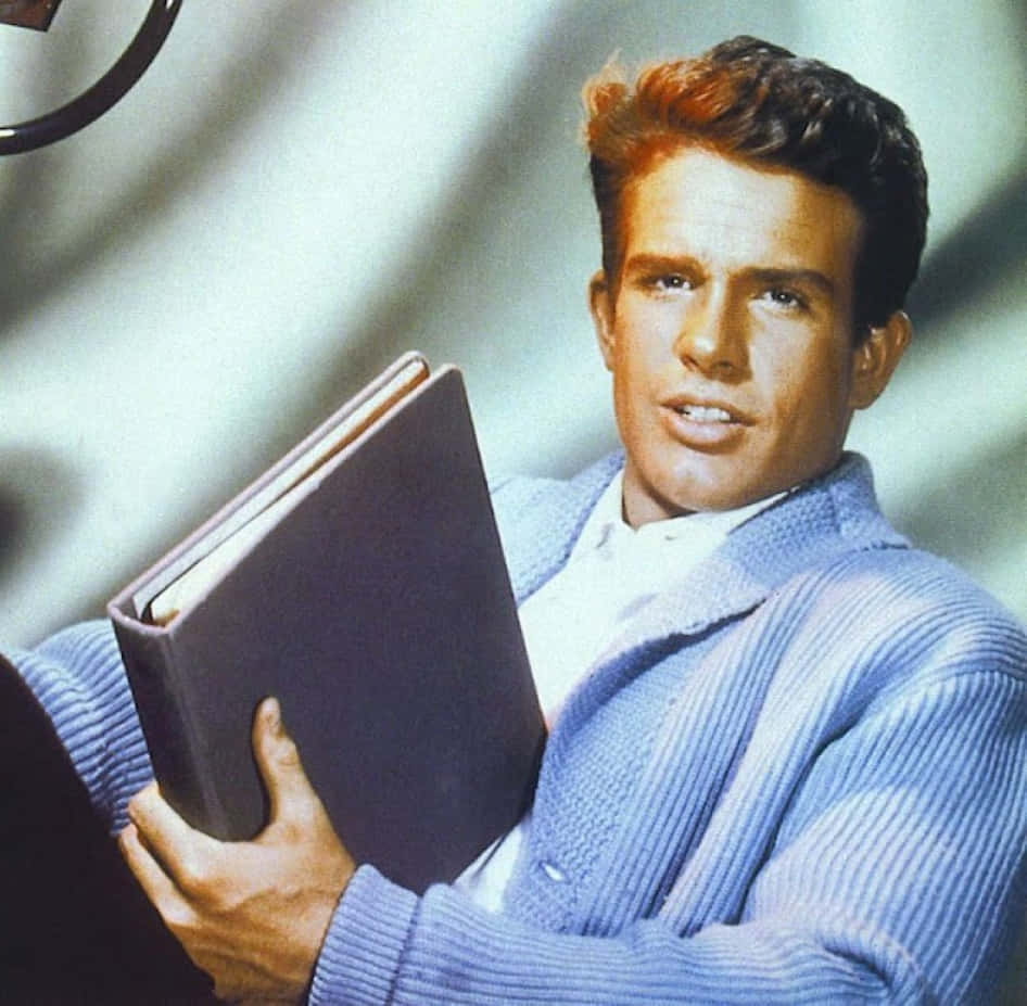 Legendary Actor Warren Beatty In A Sophisticated Portrait Background