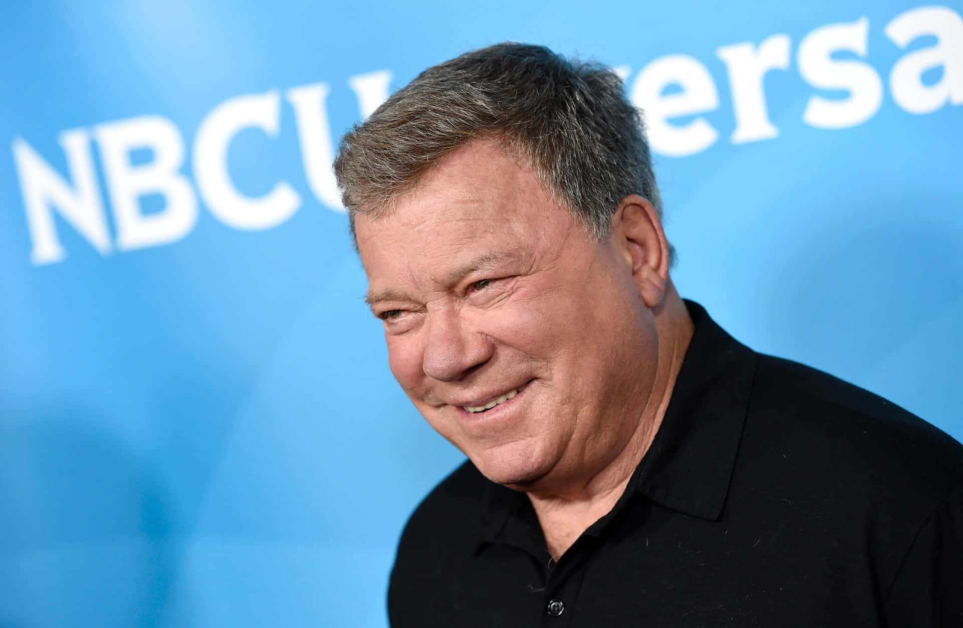 Legendary Actor William Shatner Posing Confidently Background