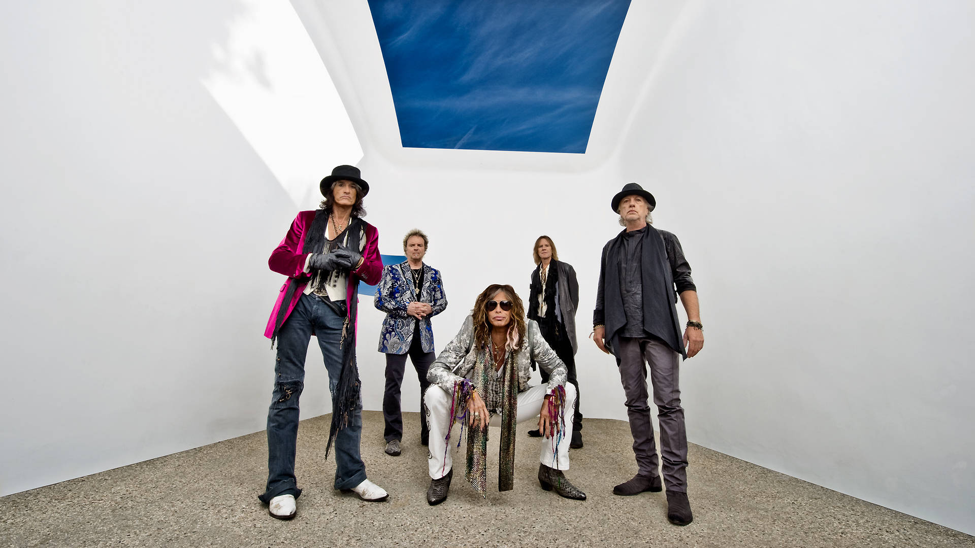 Legendary Aerosmith Group In A Classic Band Photoshoot Background