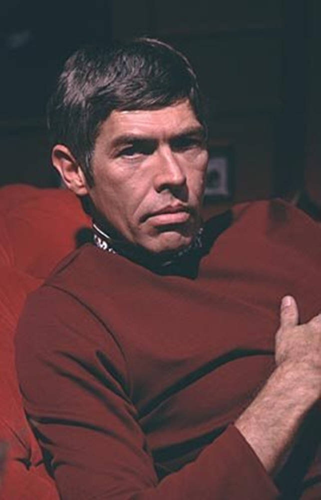 Legendary American Actor, James Coburn In Red Shirt Background