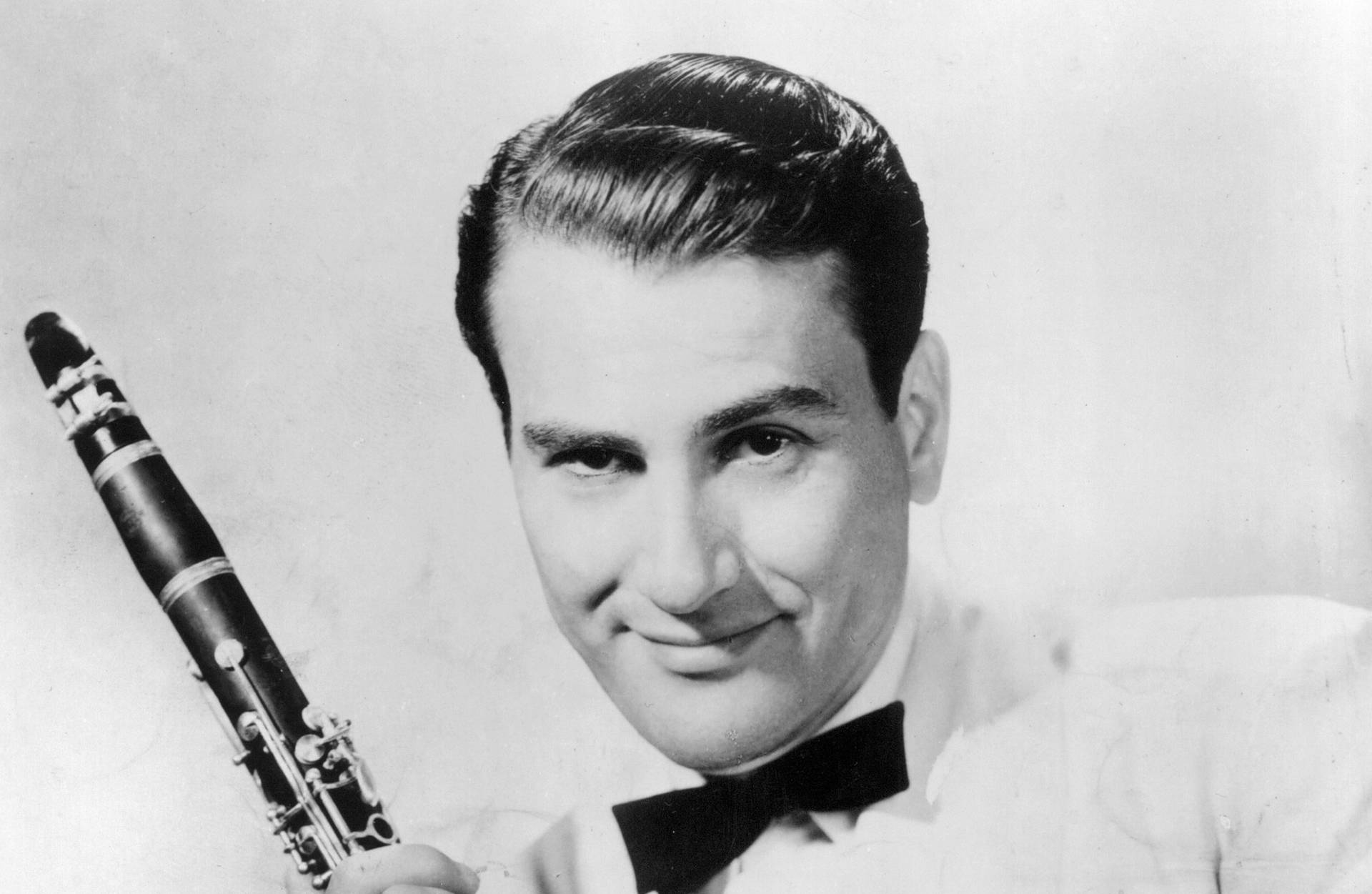 Legendary American Clarinetist, Artie Shaw In Greyscale Background