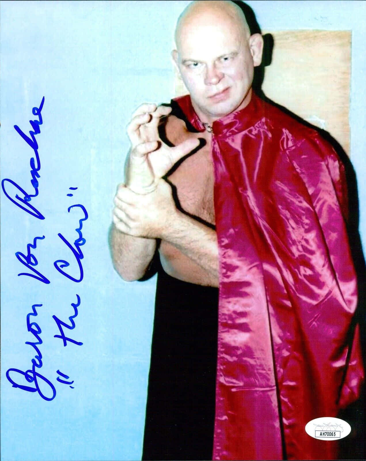 Legendary American Wrestler Baron Von Raschke Showcasing His Famous 'the Claw' Move Background
