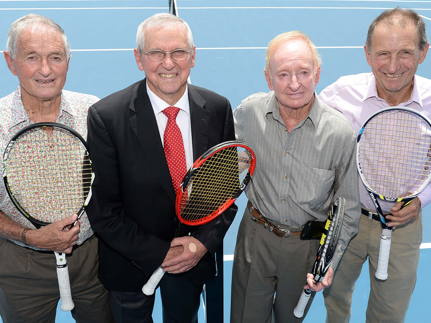 Legendary Athletes Preparing For A Game At The Roy Emerson Tennis Center Background