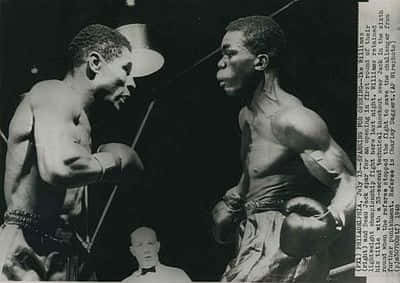 Legendary Boxer Ike Williams Posing In The Ring Background