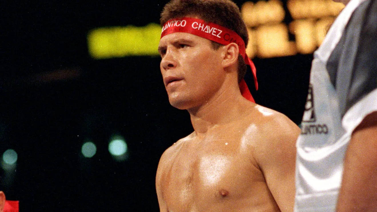 Legendary Boxer Julio Cesar Chavez Posing With Signature Headband Background