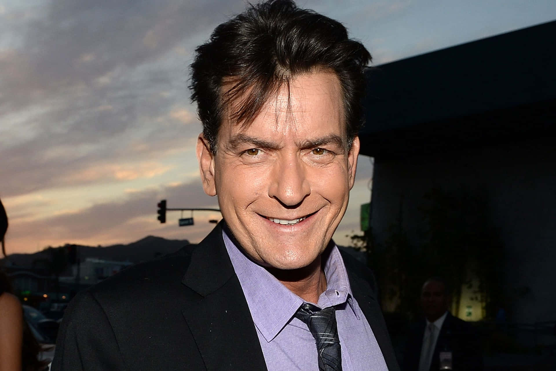 Legendary Charlie Sheen - A Snapshot From The Past Background