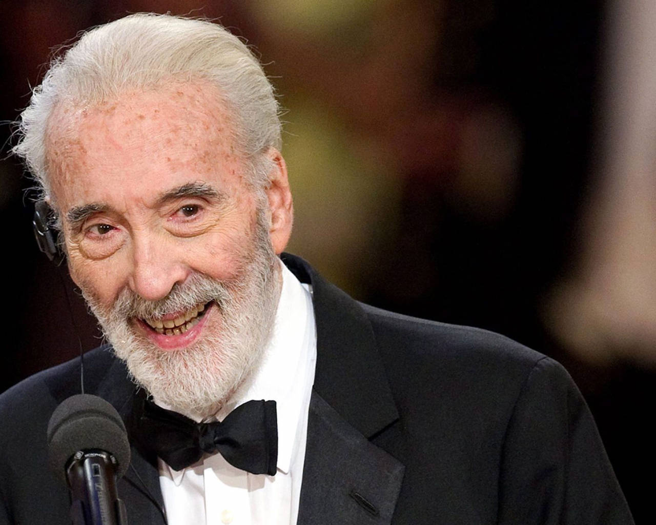 Legendary Christopher Lee At An Award Ceremony Background
