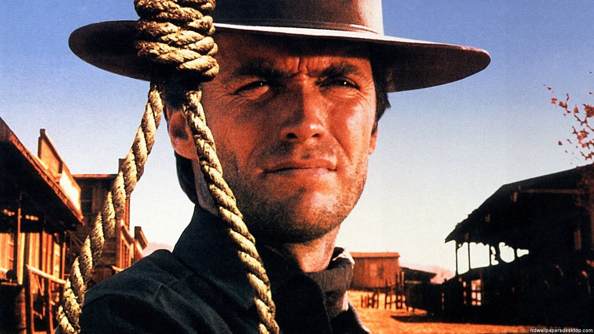 Legendary Clint Eastwood In A Pensive Mood In 'the Good, The Bad And The Ugly' Background