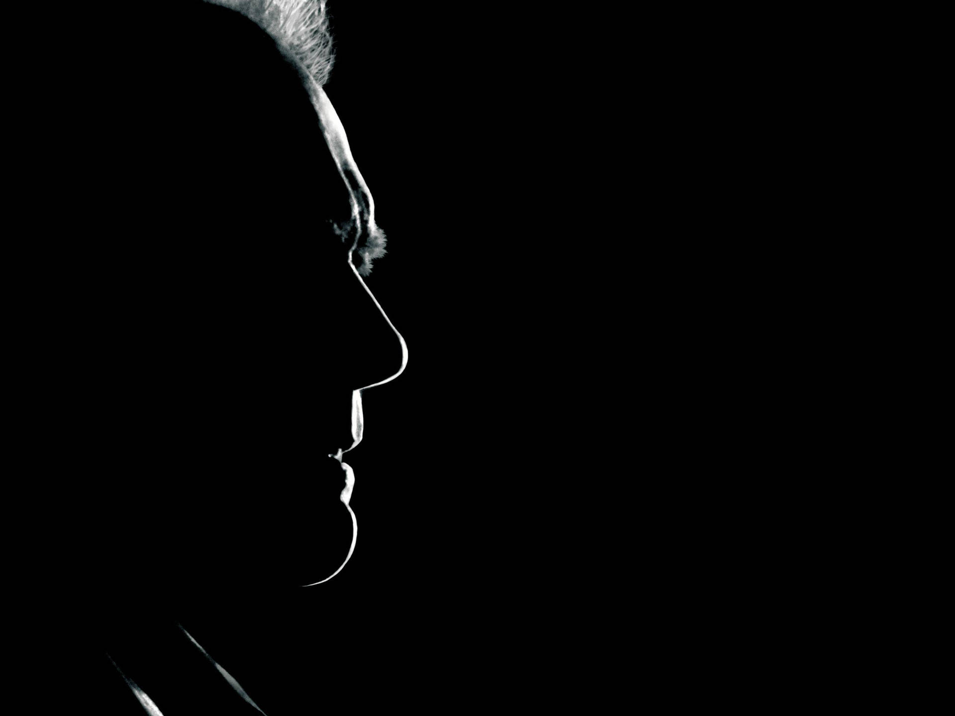 Legendary Clint Eastwood Shadowed Profile Background