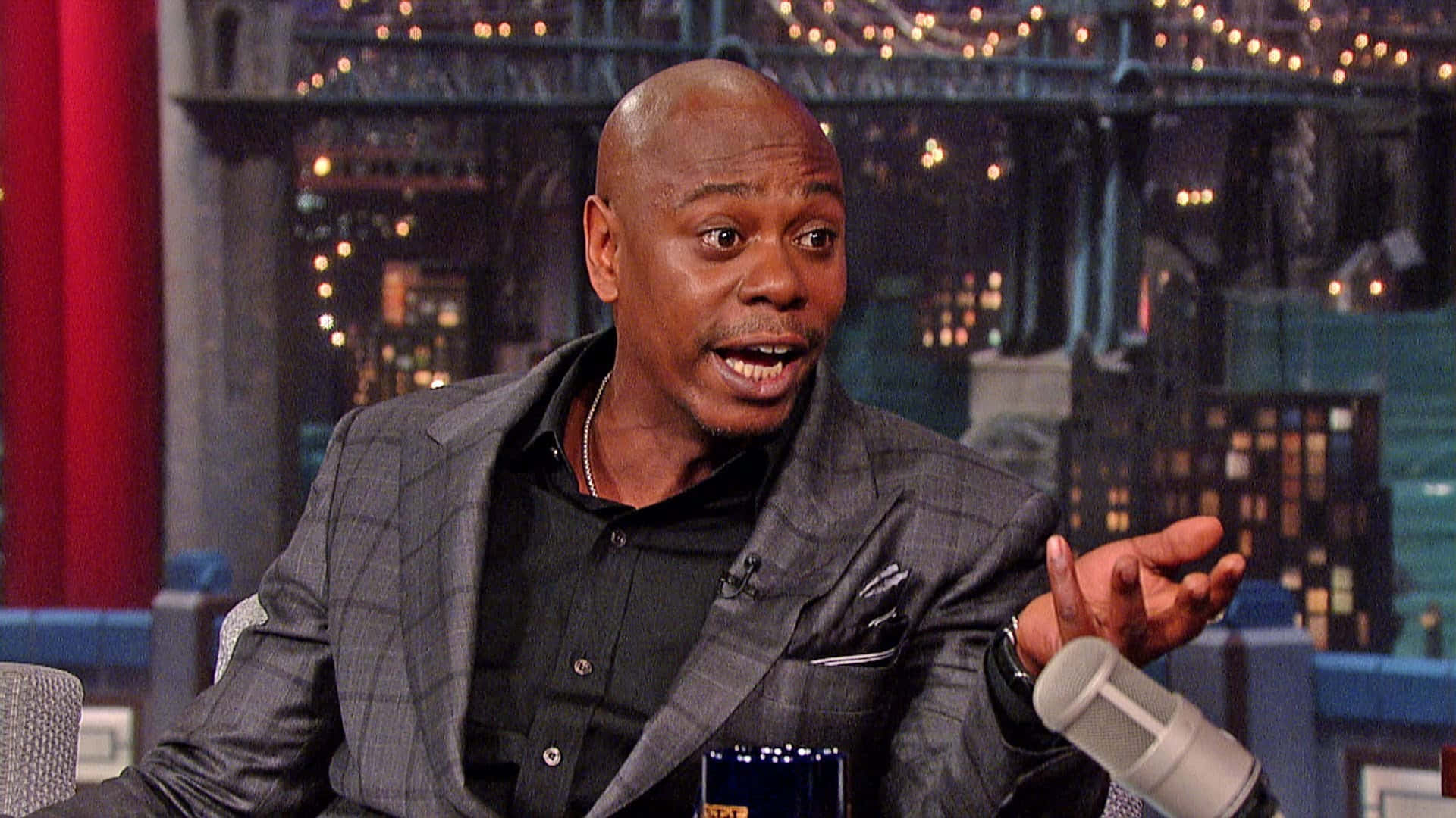 Legendary Comedian Dave Chappelle Performing Stand-up Background