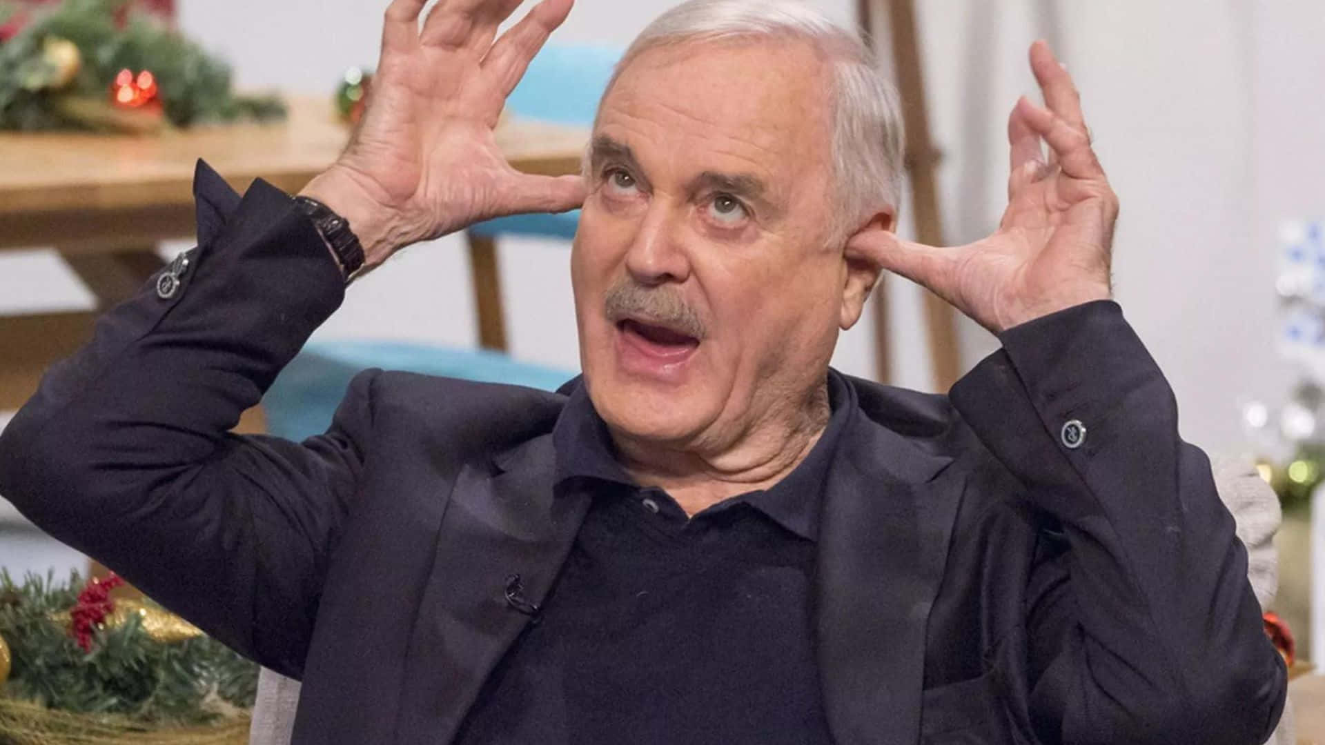 Legendary Comedian John Cleese Background