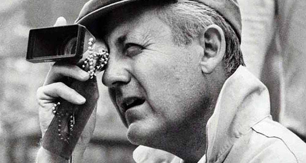 Legendary Director Robert Wise In A Classic Black And White Portrait Background