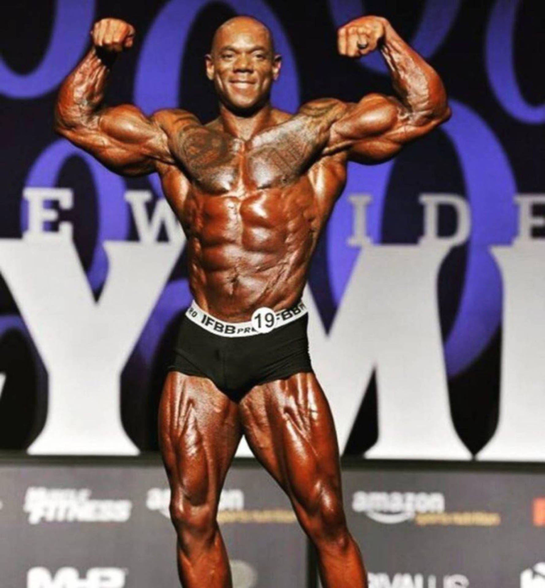 Legendary Flex Wheeler Displaying His Muscular Physique Background