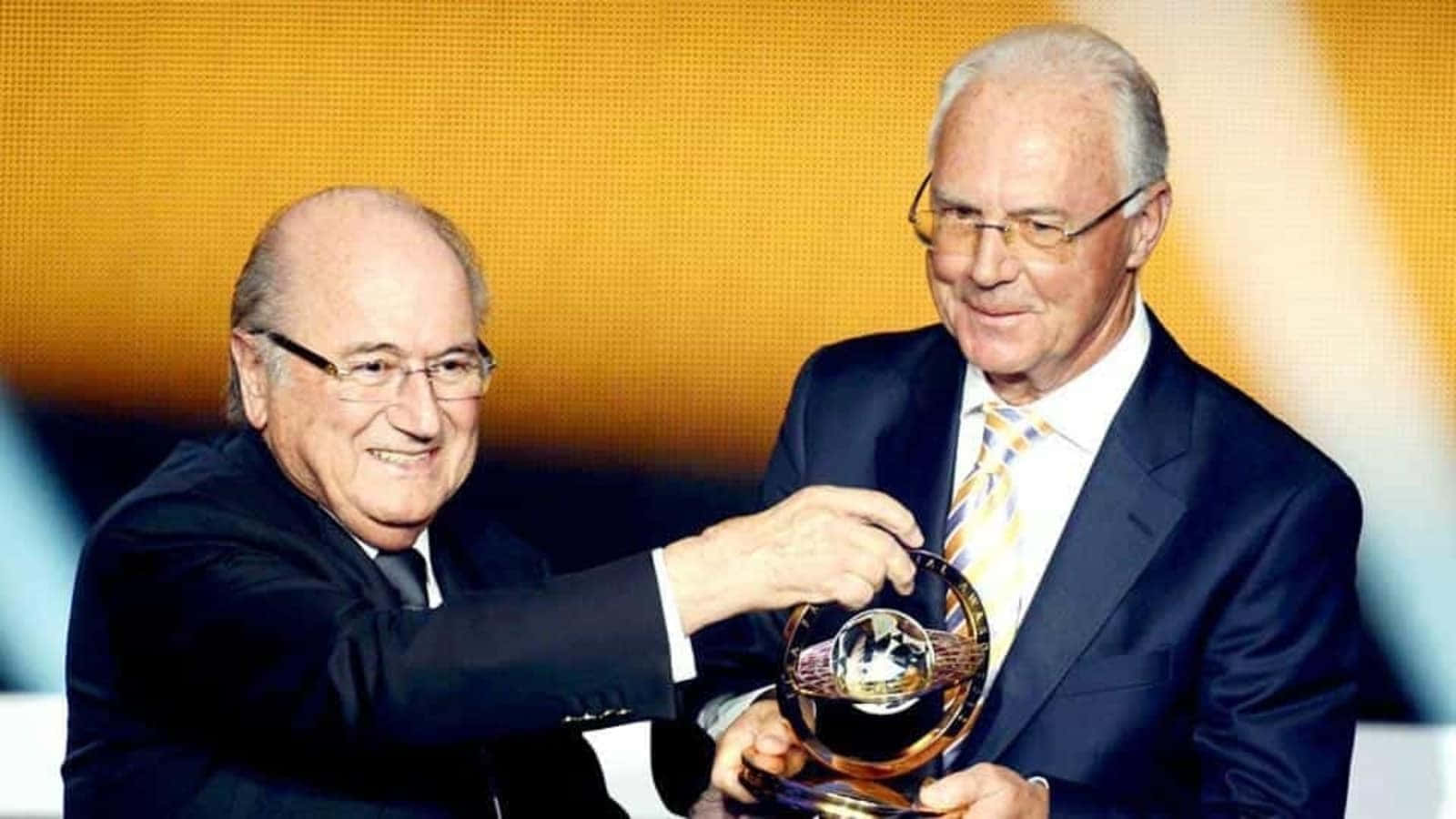 Legendary Football Figure Franz Beckenbauer At An Awards Ceremony. Background