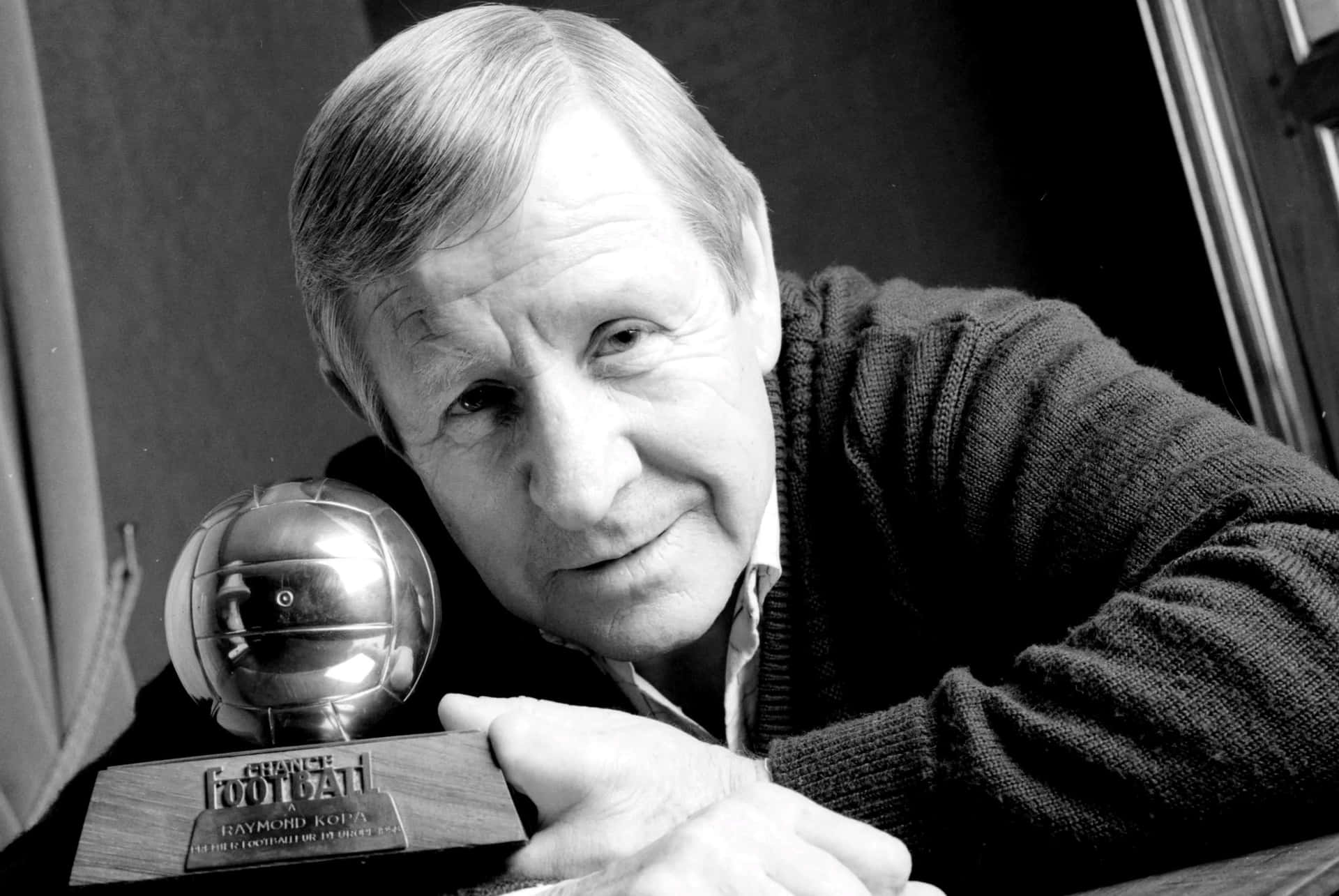 Legendary Footballerwith Trophy Background