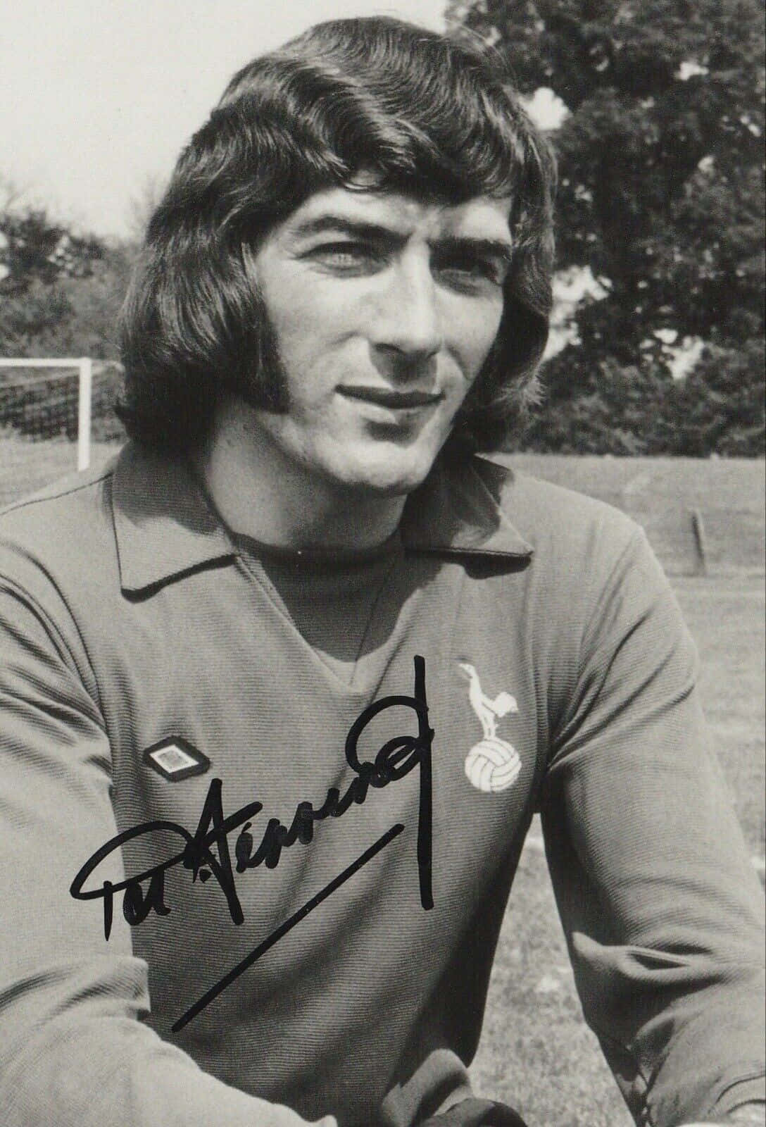 Legendary Goalkeeper Pat Jennings In Arsenal Stadium Background