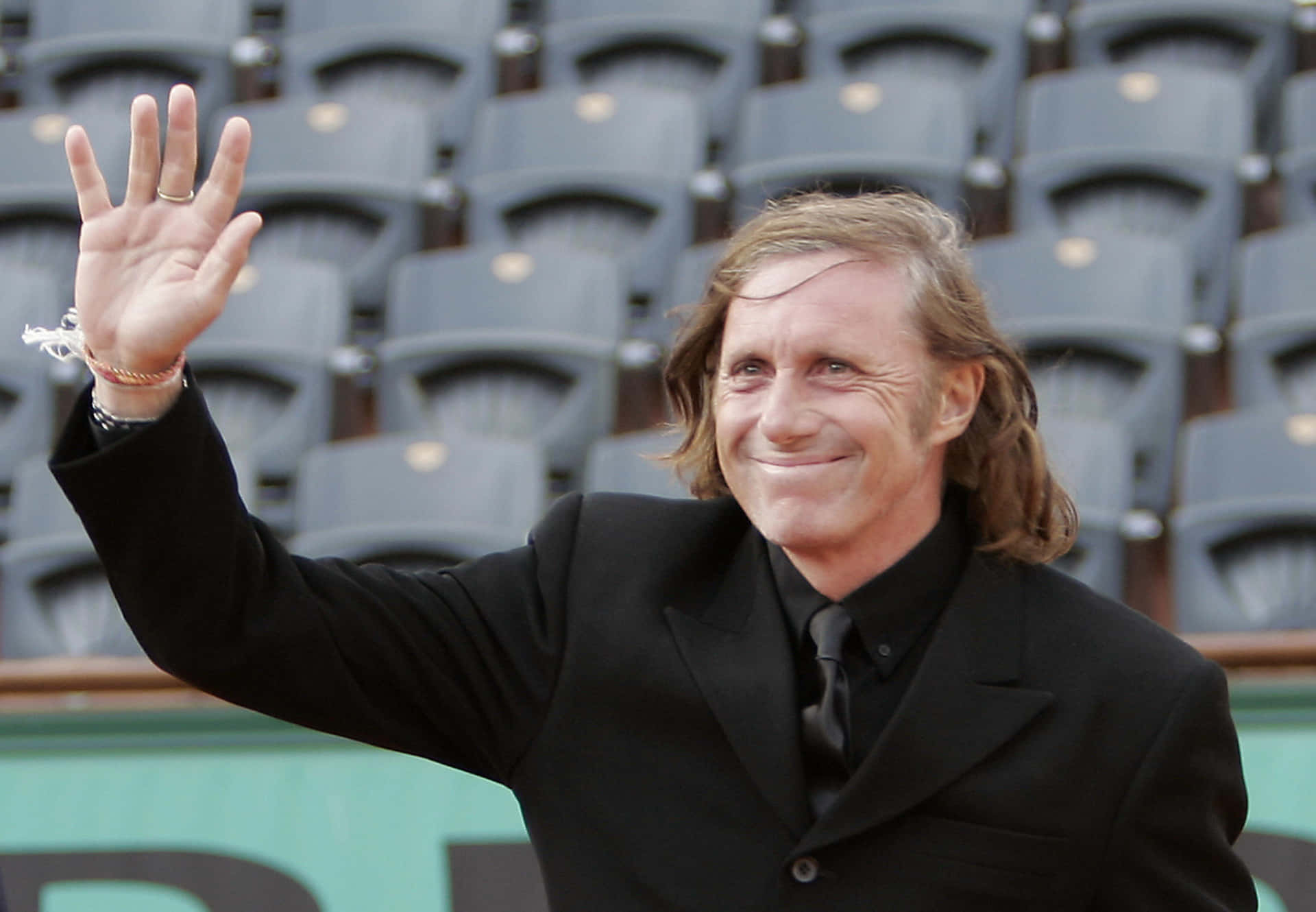 Legendary Guillermo Vilas Celebrating At The Davis Cup Final Background