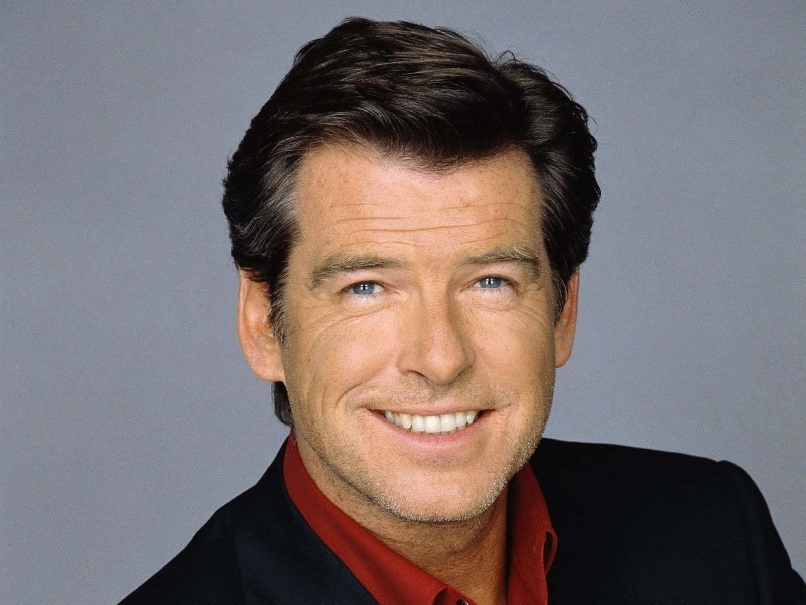 Legendary Hollywood Star Pierce Brosnan In A Candid Portrait Shot Background