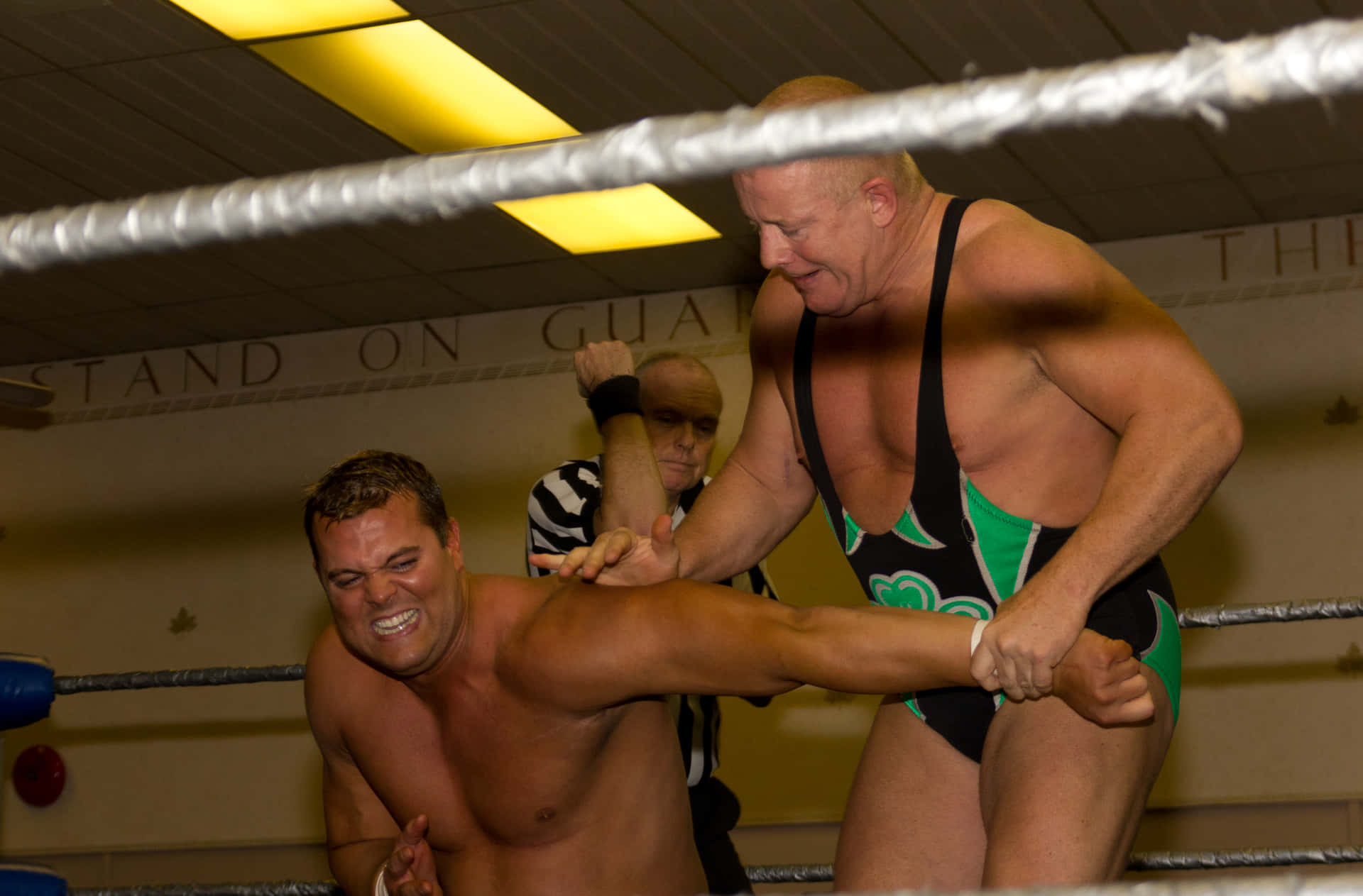 Legendary Irish Wrestler, Fit Finlay, Executing An Armbar Attack On Harry Smith. Background