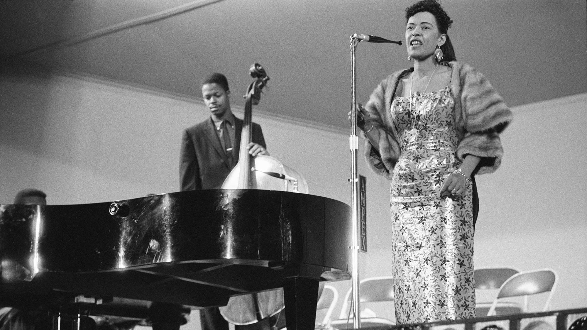 Legendary Jazz Artist Billie Holiday Performing On Stage Background