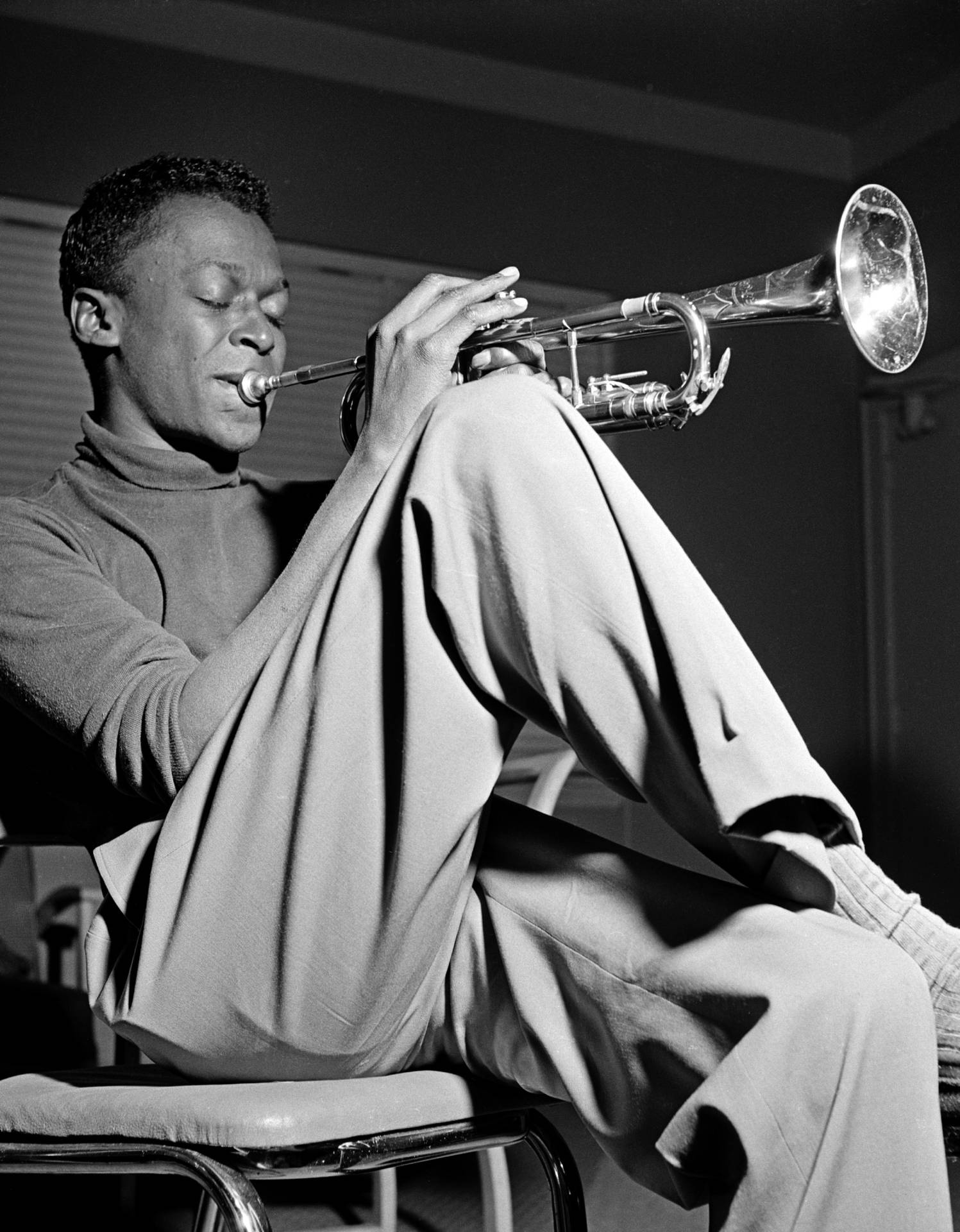 Legendary Jazz Bandleader Miles Davis Performing Background