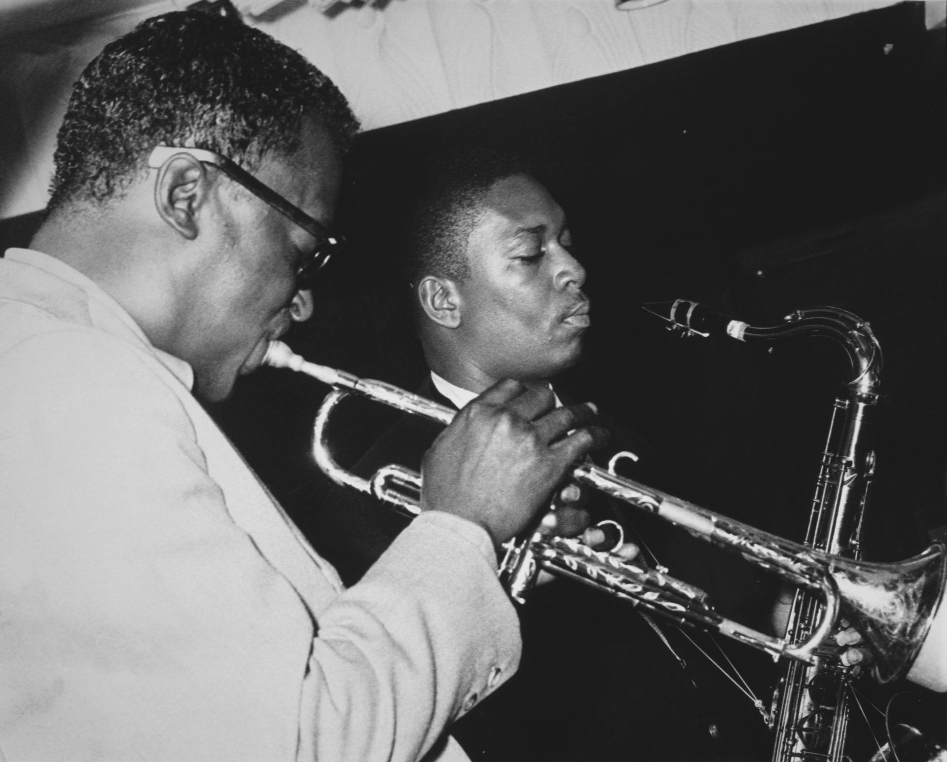 Legendary Jazz Icons - Miles Davis And John Coltrane Background