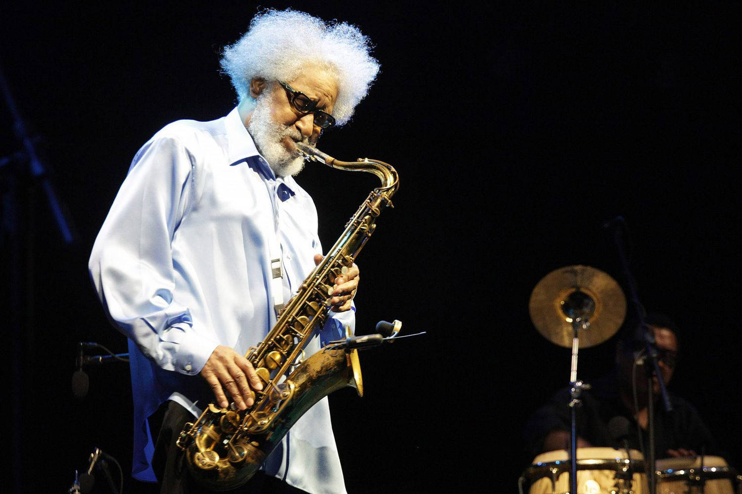 Legendary Jazz Saxophonist Sonny Rollins In Performance Background