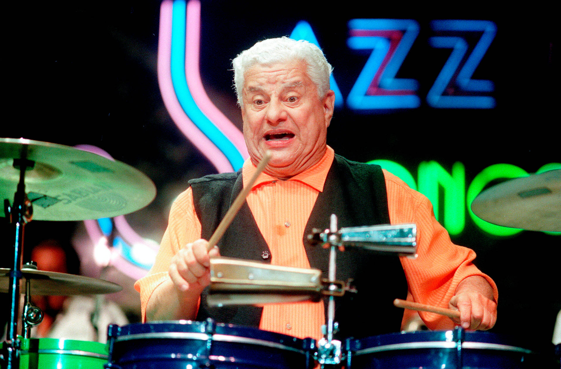 Legendary Latin Music Icon Tito Puente In Action Background