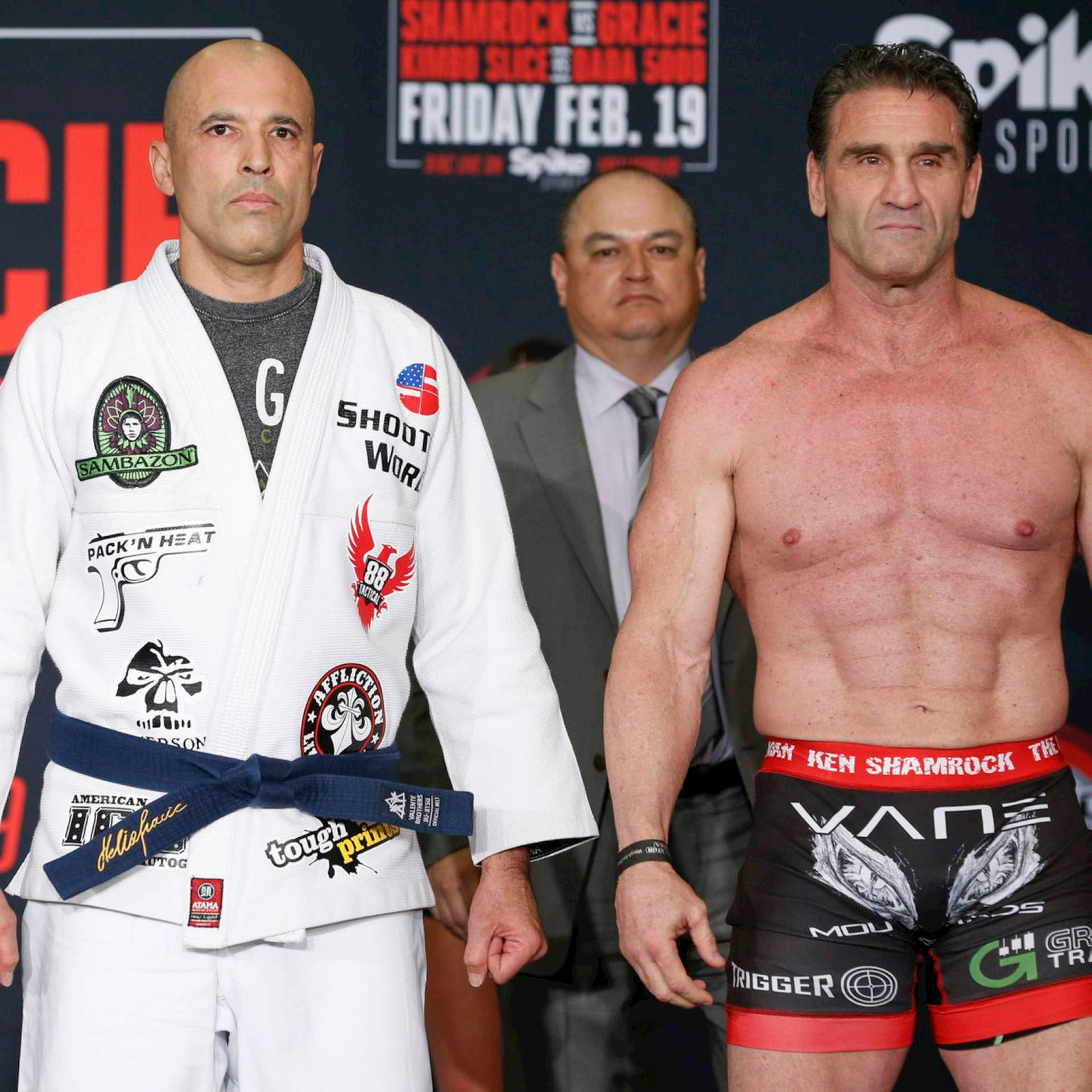 Legendary Mma Stars Ken Shamrock And Royce Gracie Striking A Pose Background