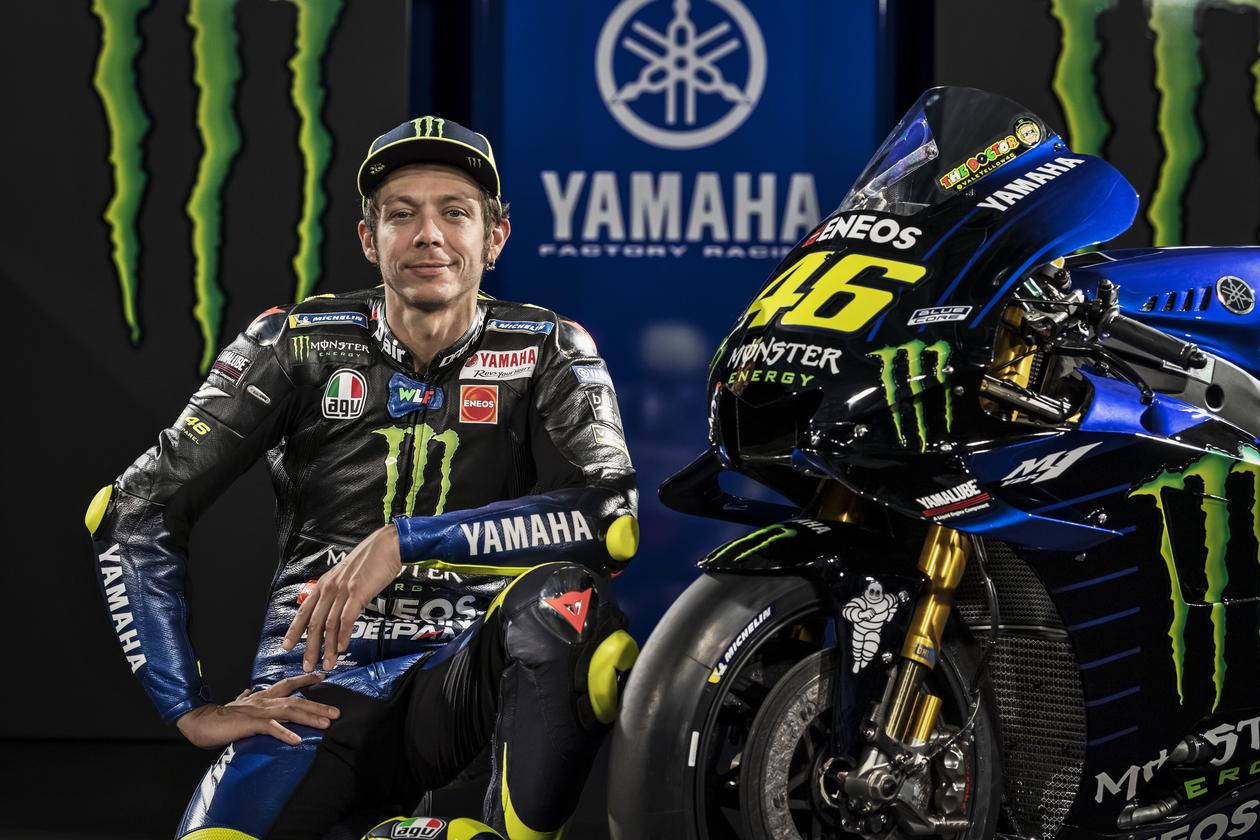 Legendary Motogp Driver Valentino Rossi Riding His Yamaha Motorcycle Background