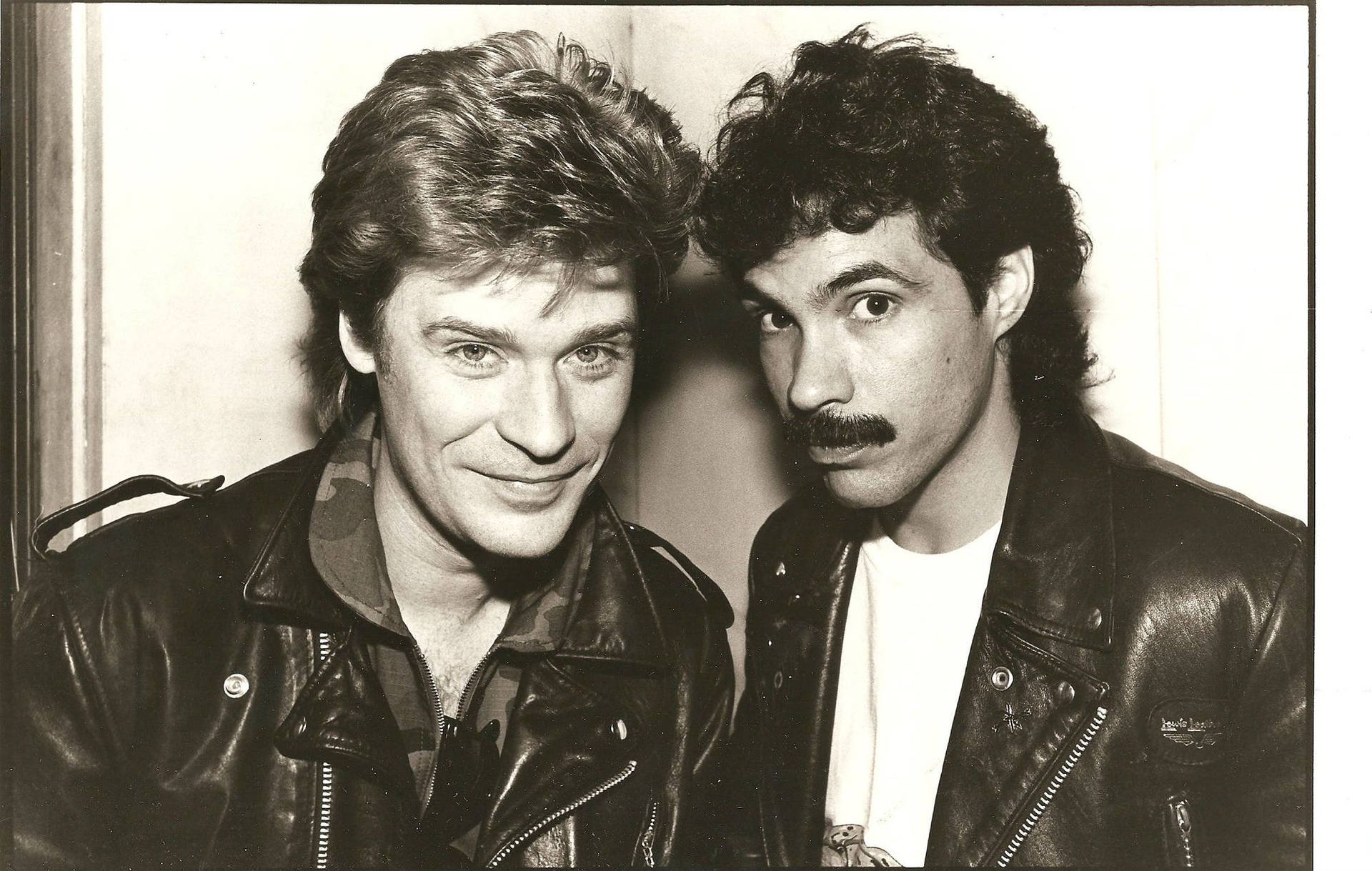 Legendary Music Duo Daryl Hall And John Oates In Retro Black & White Image Background