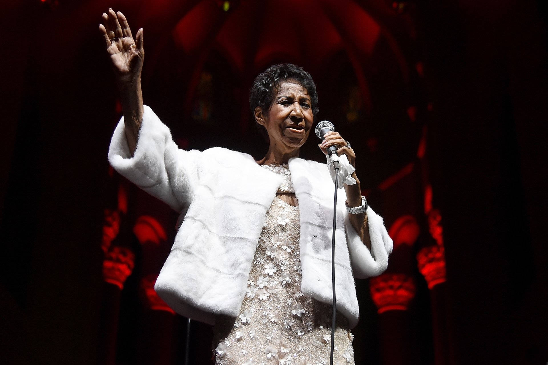 Legendary Music Icon Aretha Franklin In A White Ensemble Background