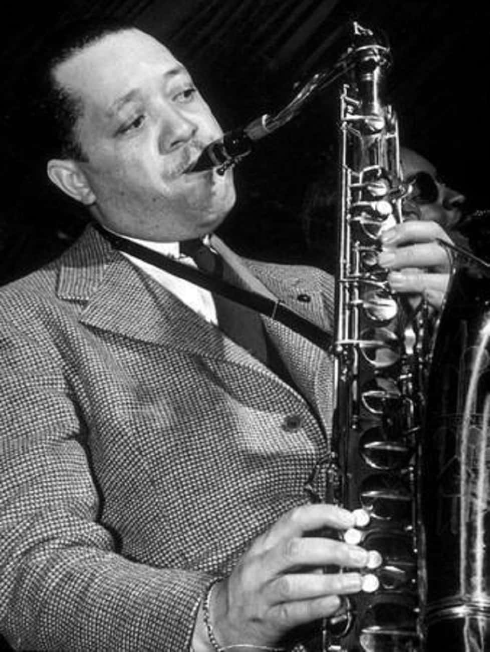 Legendary Musician Lester Young Playing The Saxophone Background