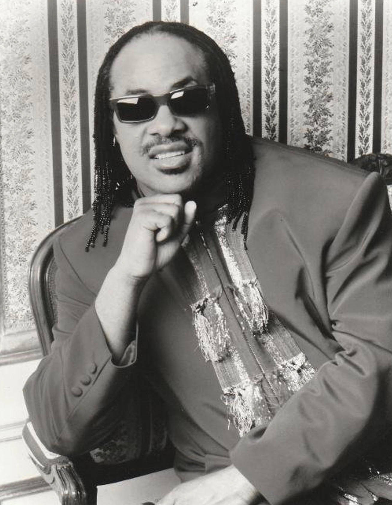 Legendary Musician, Stevie Wonder, In A Relaxed Portrait Background