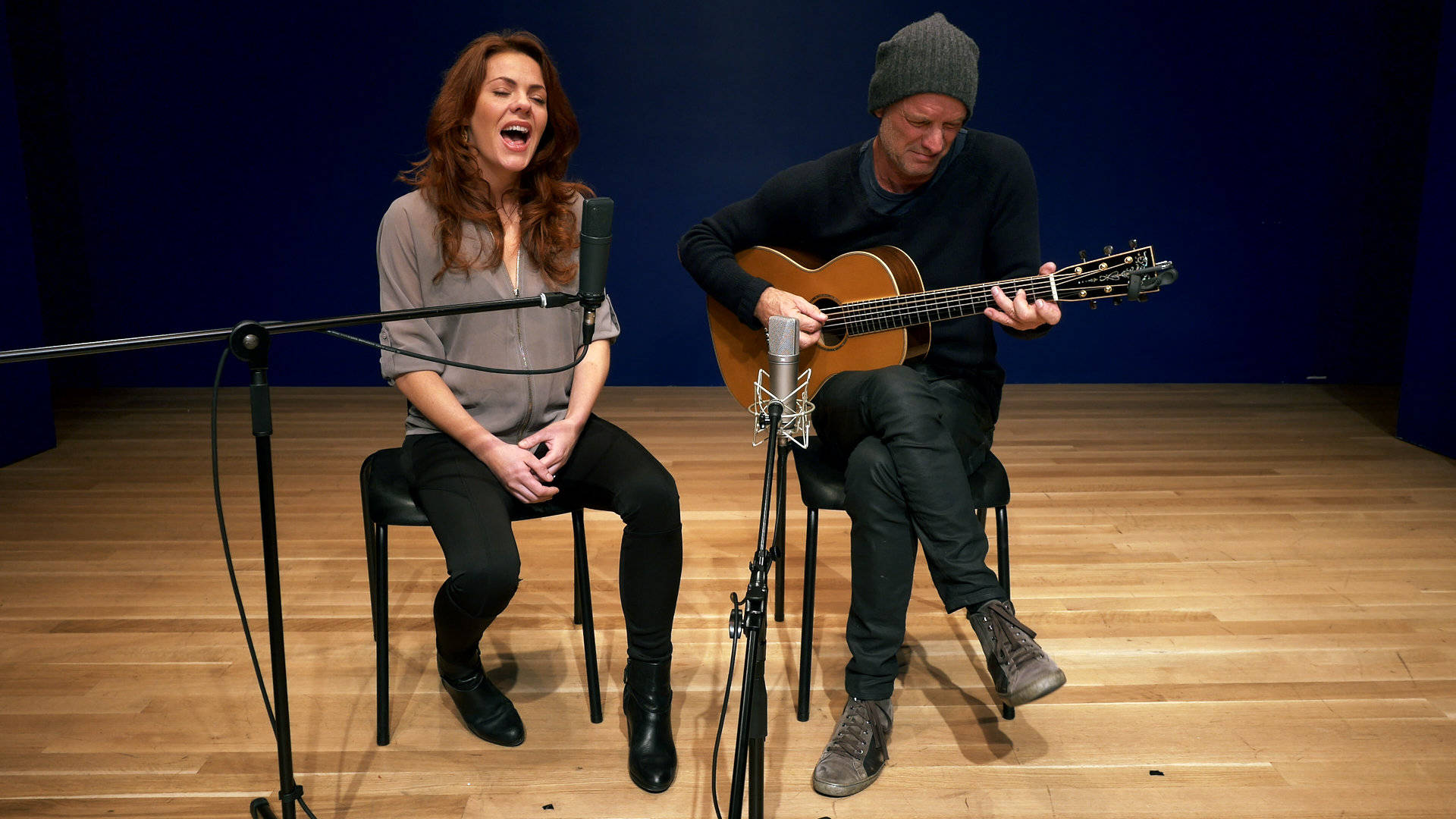 Legendary Musician Sting Serenading A Woman Background