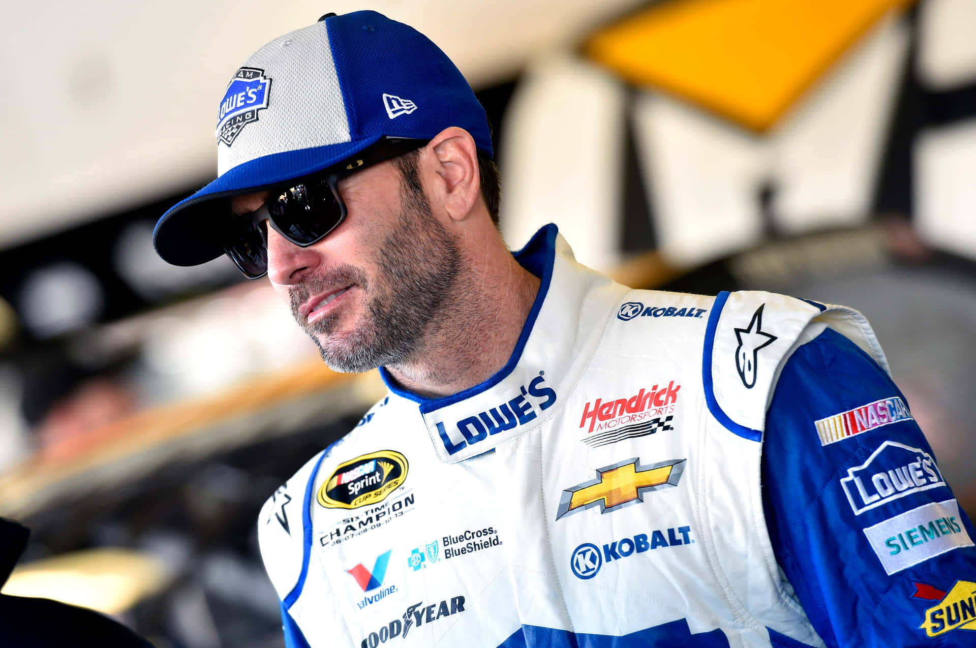 Legendary Nascar Driver, Jimmie Johnson, In The Heat Of The Race Background