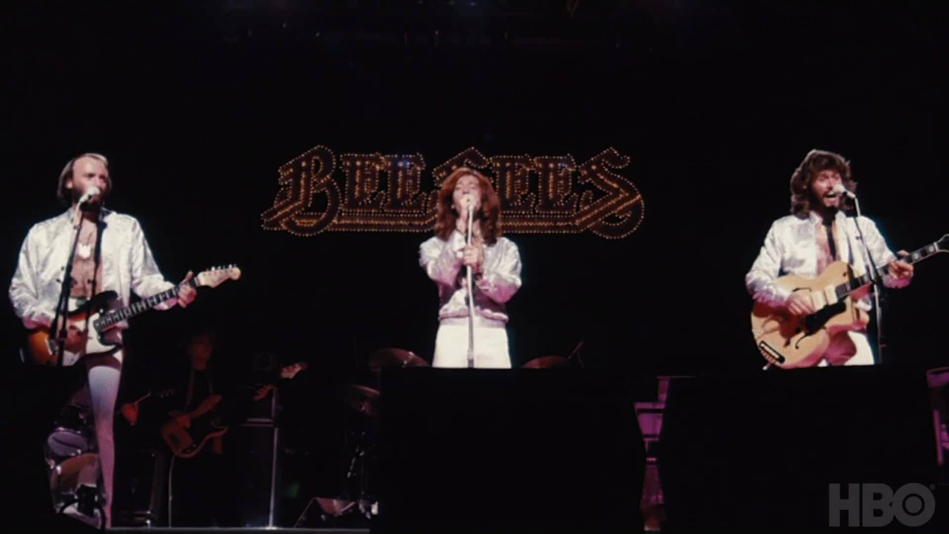 Legendary Pop Band Bee Gees In Concert Background