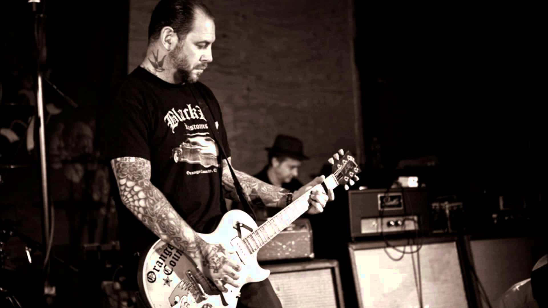 Legendary Rock Band Social Distortion In Concert Background