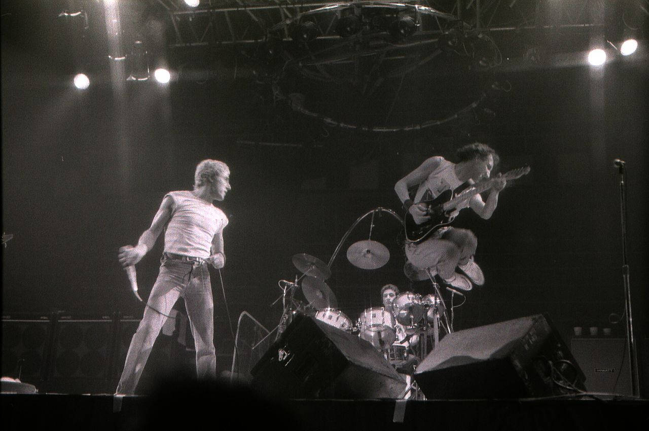 Legendary Rock Band, The Who, Performing Their Iconic Set At A Live Concert Background