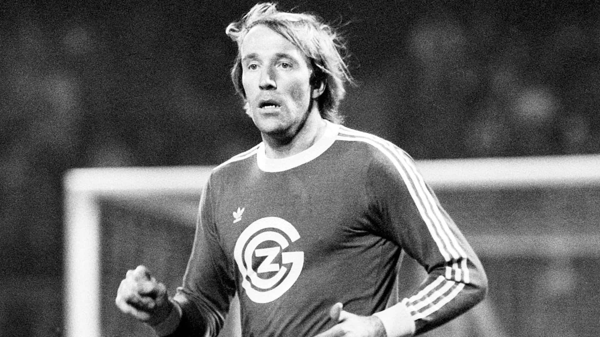 Legendary Soccer Player Gunter Netzer In Action Background