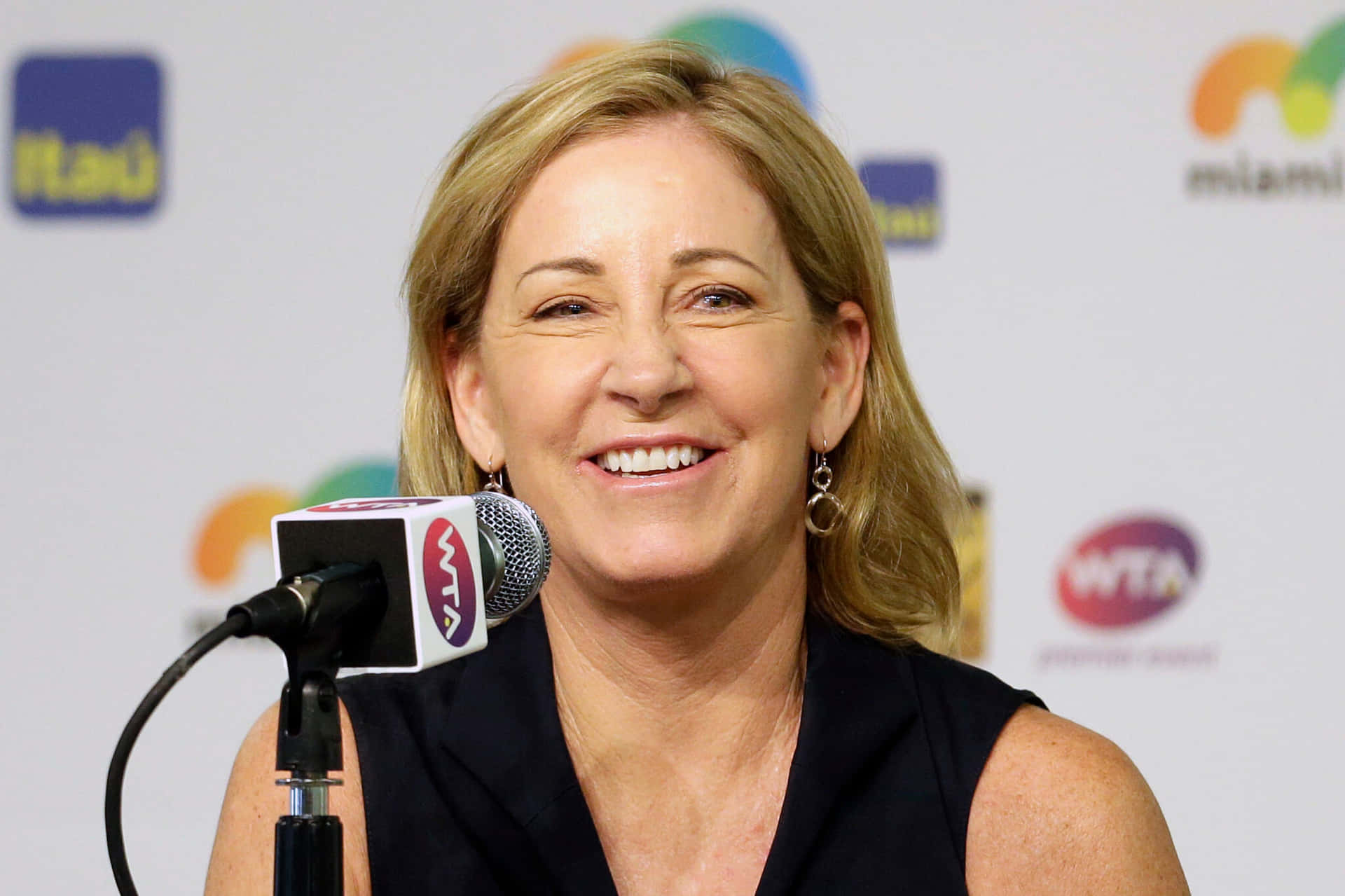 Legendary Tennis Player Chris Evert Speaking Into A Microphone