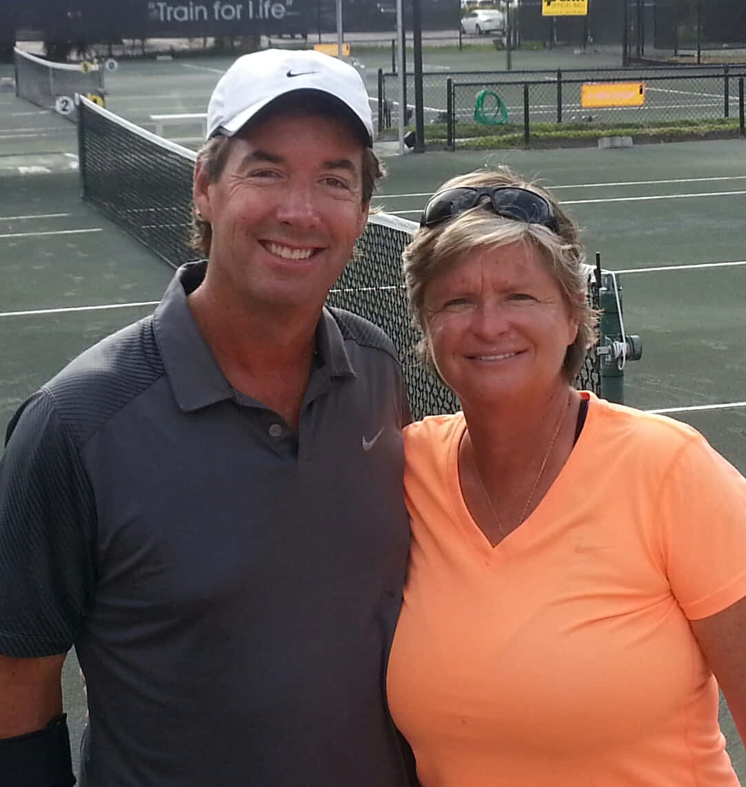 Legendary Tennis Player Hana Mandlíková Posing With Ray Collins Background
