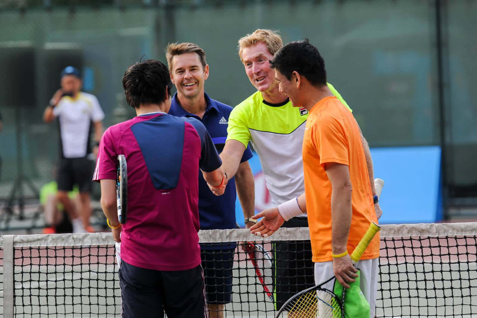 Legendary Tennis Player Todd Woodbridge Showing Sportsmanship On The Court Background