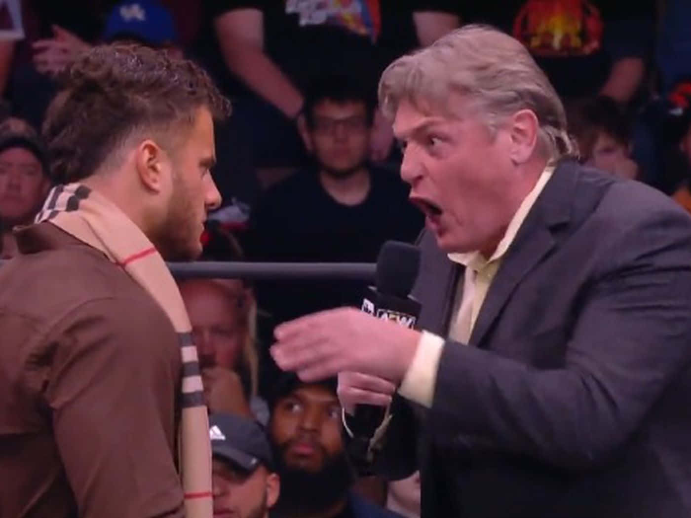 Legendary William Regal And Maxwell Jacob Friedman In An Intense Wwe Moment. Background